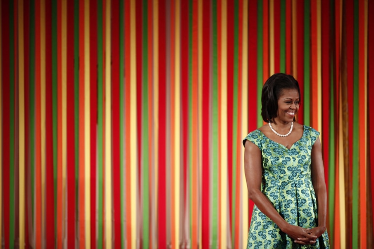 Image: First lady Michelle Obama at the first White House \"Kids state dinner\" in the East Room of the White House.